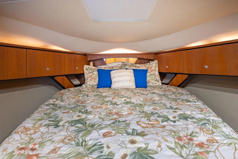  Yacht Photos Pics Luxurious 2007 Tiara Yachts 4300 Sovran cabin with floral bedding and wooden cabinets.