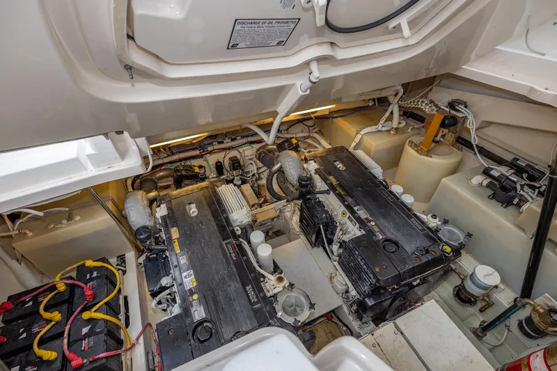  Yacht Photos Pics Engine room of 2007 Tiara Yachts 4300 Sovran, featuring dual engines and battery setup.