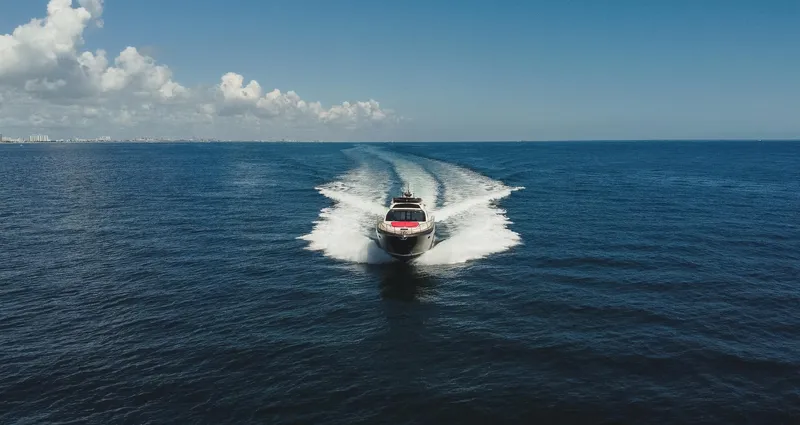  Yacht Photos Pics 2011 Riva SportRiva 56 yacht cruising on open sea under clear blue sky.