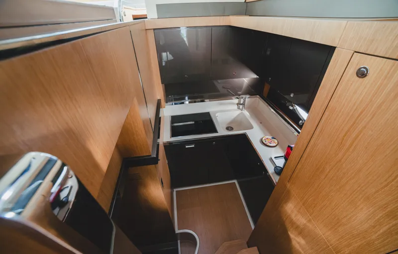  Yacht Photos Pics 2011 Riva SportRiva 56 yacht kitchen with modern wood cabinetry and sleek design.