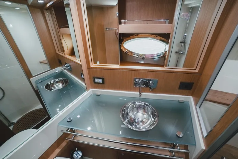  Yacht Photos Pics Luxurious bathroom interior of 2011 Riva SportRiva 56 yacht with modern fixtures.