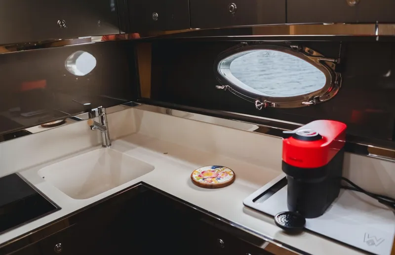  Yacht Photos Pics Luxurious 2011 Riva SportRiva 56 yacht kitchen with modern appliances and sleek design.