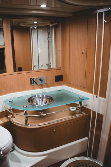  Yacht Photos Pics Luxurious bathroom in 2011 Riva SportRiva 56 yacht with modern fixtures and wood accents.