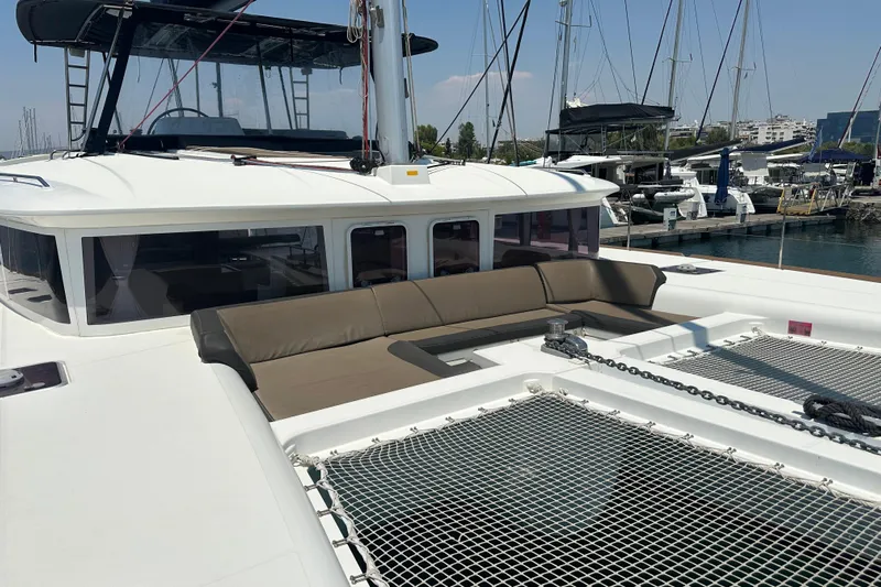  Yacht Photos Pics Lagoon 450 catamaran, 2012 model, docked with spacious deck and seating area.