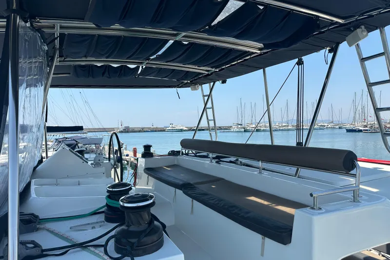  Yacht Photos Pics Lagoon 450 catamaran deck, 2012 model, docked at marina with clear blue sky.