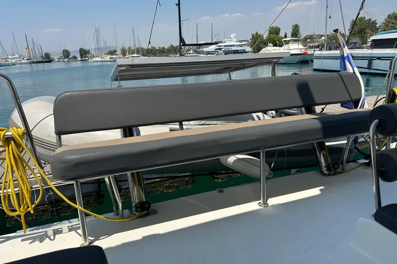  Yacht Photos Pics 2012 Lagoon 450 yacht with seating area, docked in a marina.