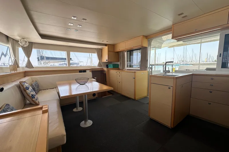  Yacht Photos Pics Spacious interior of 2012 Lagoon 450 catamaran with modern kitchen and seating area.