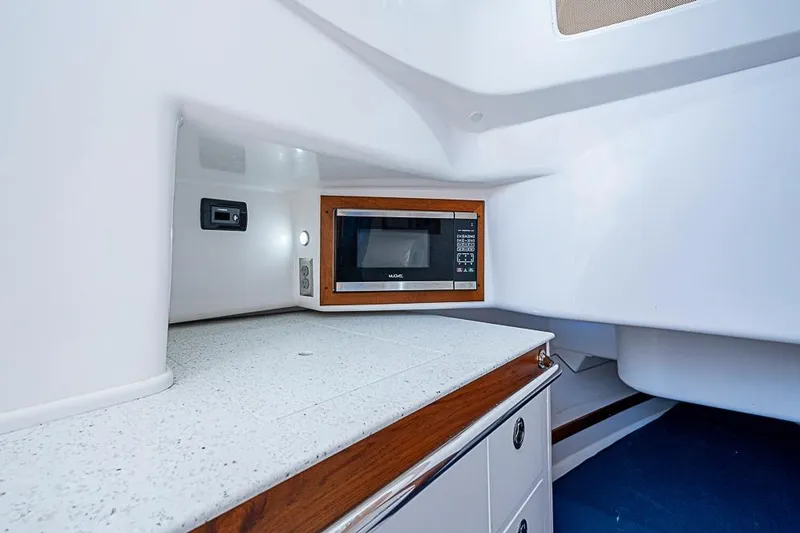 Blue Streak Yacht Photos Pics 2018 Hunt Yachts 32 Center Console interior with microwave and sleek countertop.