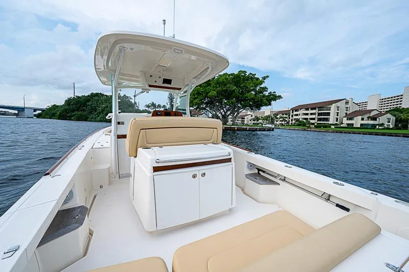 Blue Streak Yacht Photos Pics 2018 Hunt Yachts 32 Center Console on calm water, featuring spacious seating and sleek design.