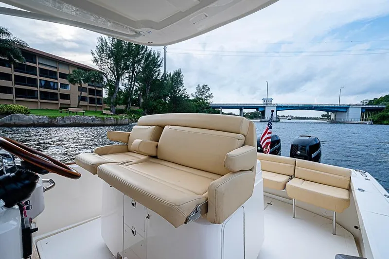 Blue Streak Yacht Photos Pics 2018 Hunt Yachts 32 Center Console on a scenic waterway with bridge view.