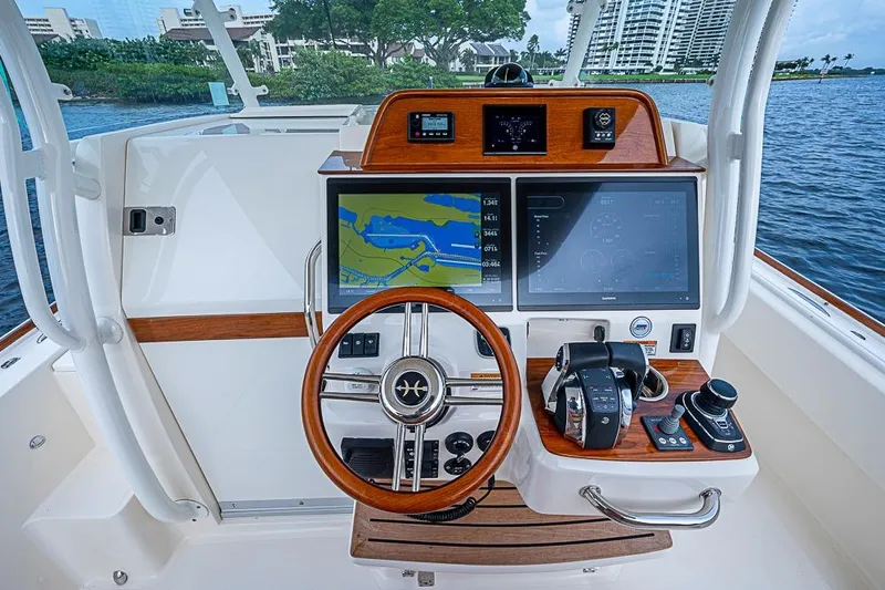 Blue Streak Yacht Photos Pics 2018 Hunt Yachts 32 Center Console helm with navigation screens and controls.