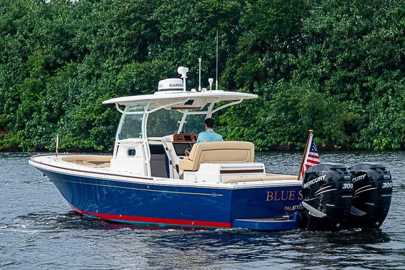Blue Streak Yacht Photos Pics 2018 Hunt Yachts 32 Center Console cruising on water, featuring dual Mercury engines.
