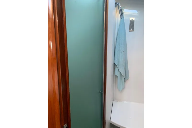  Yacht Photos Pics Shower area in 2004 Beneteau Oceanis Clipper 523 yacht with towel hanging.