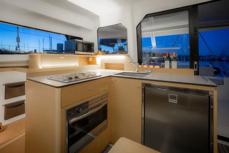 Eli X Yacht Photos Pics Modern kitchen interior on 2023 Excess 11 yacht with appliances and sleek design.