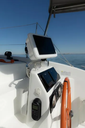 Eli X Yacht Photos Pics 2023 Excess 11 yacht helm with navigation equipment and orange steering wheel.