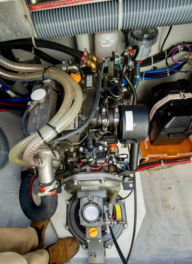 Eli X Yacht Photos Pics Engine compartment of a 2023 Excess 11 boat, showcasing mechanical components and wiring.