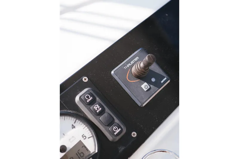 Almissa Yacht Photos Pics Control panel of 2023 Lagoon 46 yacht featuring thruster joystick and buttons.