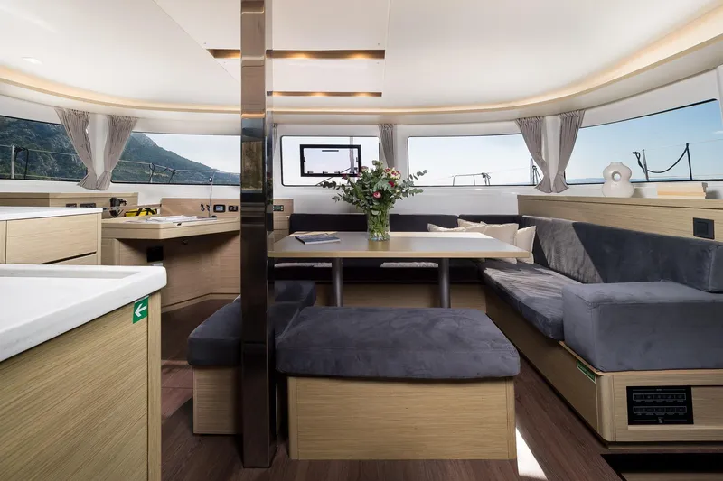 Almissa Yacht Photos Pics Luxurious interior of 2023 Lagoon 46 yacht with modern seating and elegant decor.