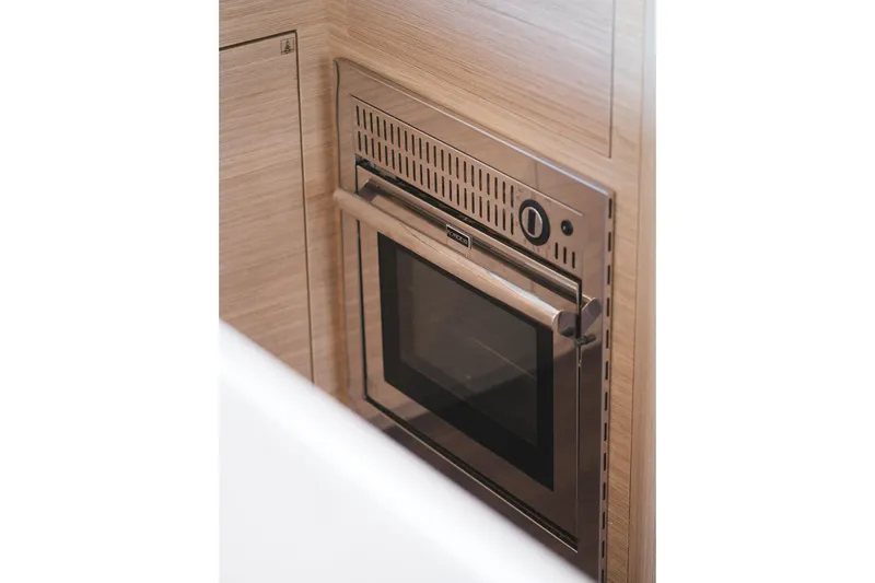 Almissa Yacht Photos Pics Built-in oven in 2023 Lagoon 46 yacht kitchen, featuring sleek stainless steel design.