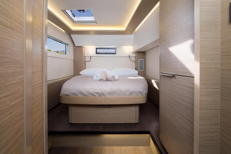 Almissa Yacht Photos Pics Luxurious cabin interior of 2023 Lagoon LAGOON 46 yacht with modern design and skylight.