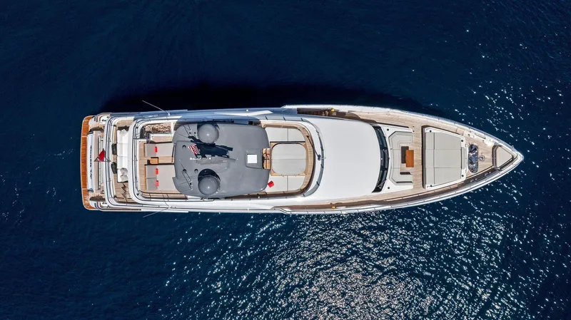 Double Up Yacht Photos Pics Aerial view of 2024 Custom Line Navetta 33 yacht on deep blue water.