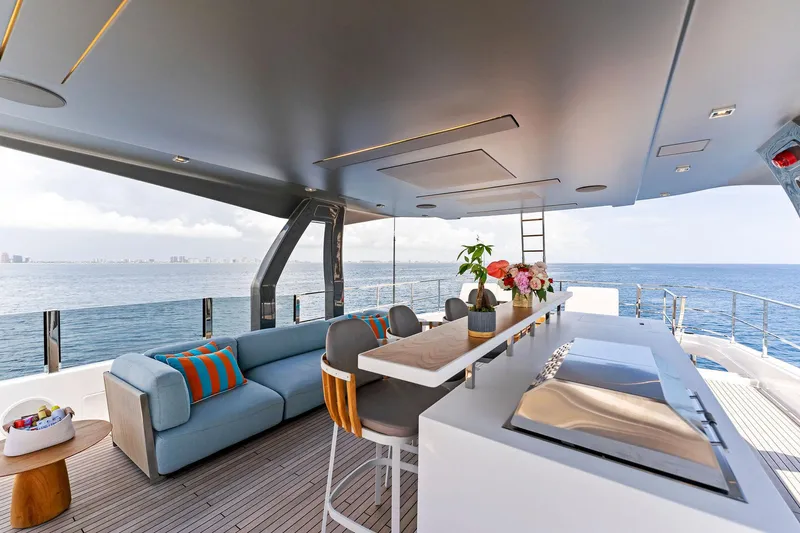 Double Up Yacht Photos Pics Luxurious 2024 Custom Line Navetta 33 yacht interior with modern seating and ocean view.