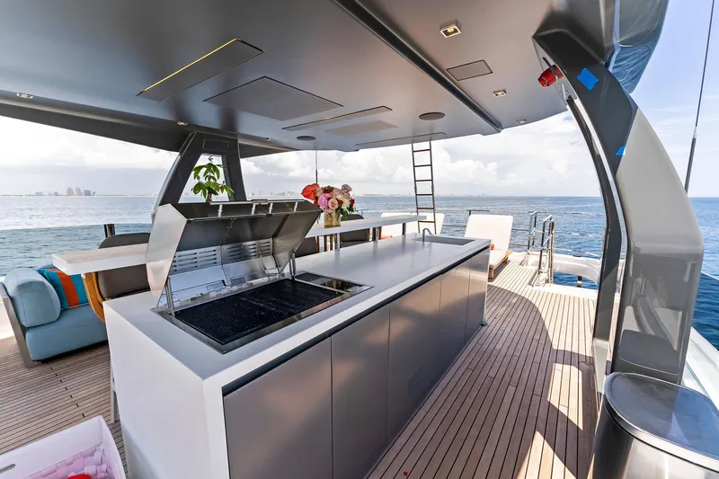 Double Up Yacht Photos Pics Luxurious 2024 Custom Line Navetta 33 yacht deck with modern outdoor kitchen and ocean view.