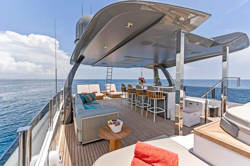 Double Up Yacht Photos Pics Luxurious 2024 Custom Line Navetta 33 yacht deck with seating and ocean view.