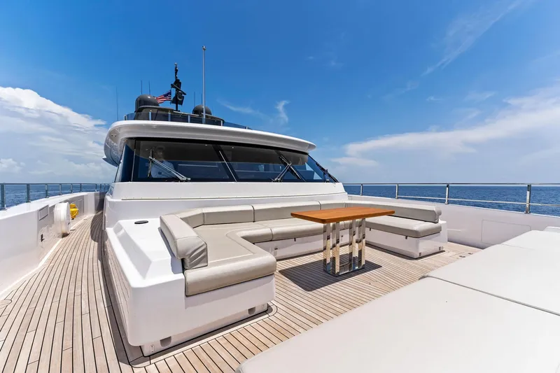 Double Up Yacht Photos Pics Luxurious 2024 Custom Line Navetta 33 yacht with spacious deck seating and ocean view.