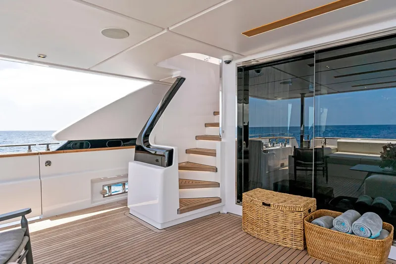 Double Up Yacht Photos Pics Luxurious 2024 Custom Line Navetta 33 yacht deck with stairs and ocean view.