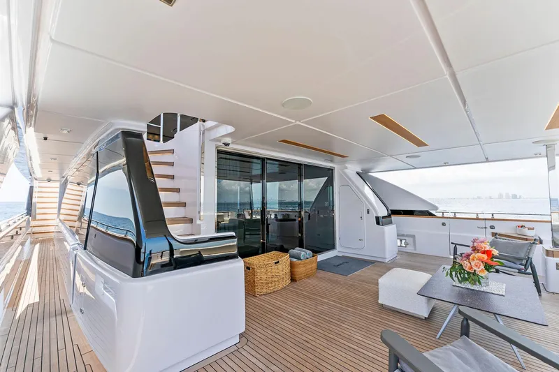Double Up Yacht Photos Pics Luxurious 2024 Custom Line Navetta 33 yacht deck with modern seating and ocean view.