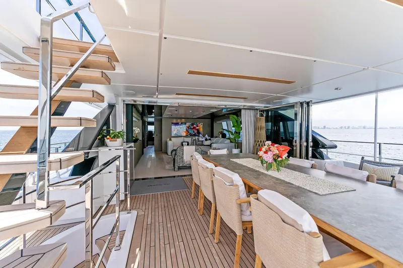Double Up Yacht Photos Pics Luxurious 2024 Custom Line Navetta 33 yacht interior with elegant dining area and modern design.