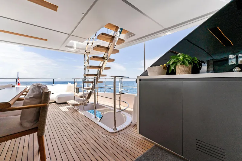 Double Up Yacht Photos Pics Luxurious 2024 Custom Line Navetta 33 yacht deck with elegant seating and ocean view.
