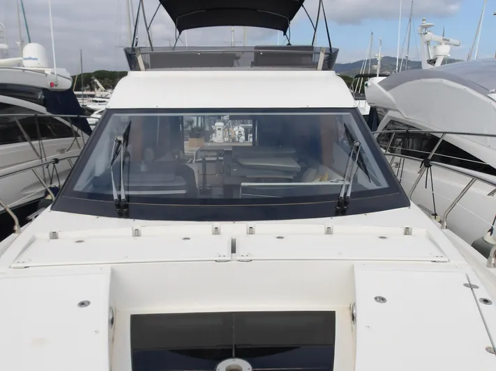  Yacht Photos Pics 2023 Galeon 500 Fly yacht docked at marina, front view with sleek design.