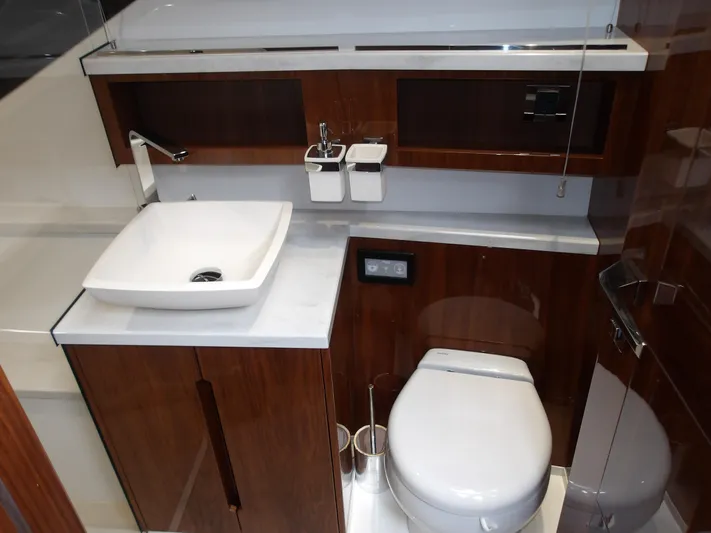  Yacht Photos Pics Modern bathroom in 2023 Galeon 500 Fly yacht with sleek fixtures and wood accents.