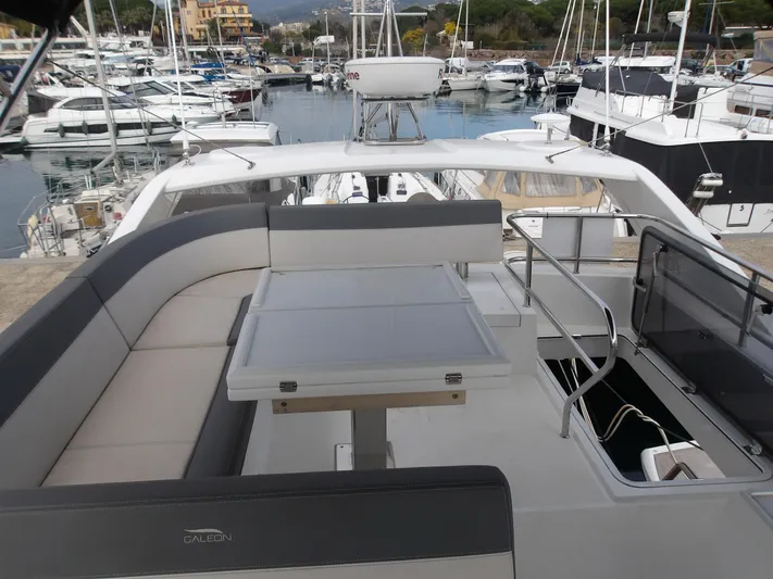  Yacht Photos Pics 2023 Galeon 500 Fly yacht with spacious deck and seating at marina.