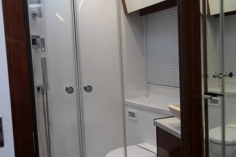  Yacht Photos Pics Luxurious bathroom interior of 2023 Galeon 500 Fly yacht, featuring modern fixtures and elegant design.