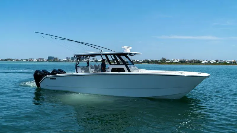  Yacht Photos Pics 2024 Invincible 40' Catamaran cruising on a sunny day.