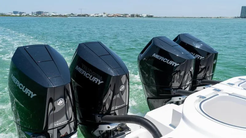  Yacht Photos Pics 2024 Invincible 40' Catamaran with four Mercury outboard engines on the water.