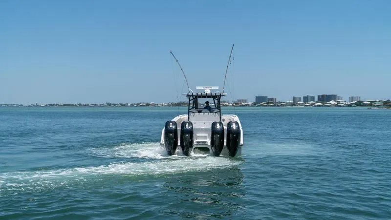  Yacht Photos Pics 2024 Invincible 40' Catamaran cruising on open water.