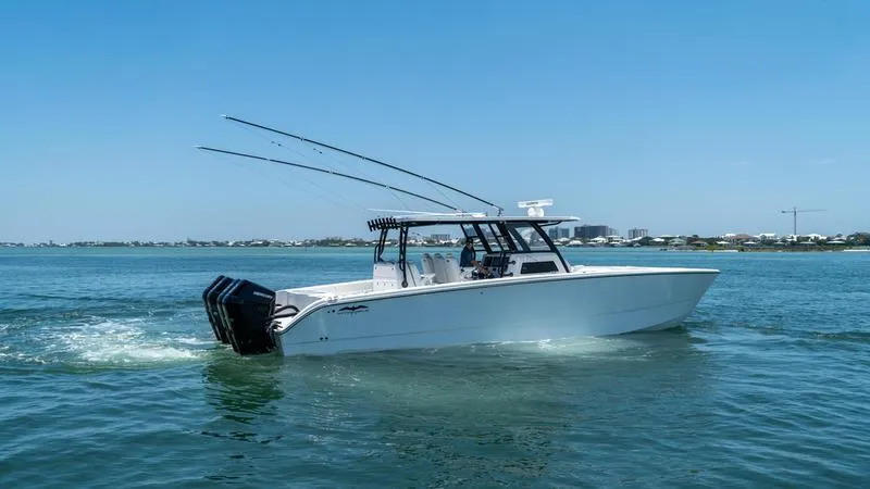  Yacht Photos Pics 2024 Invincible 40' Catamaran cruising on a sunny day.