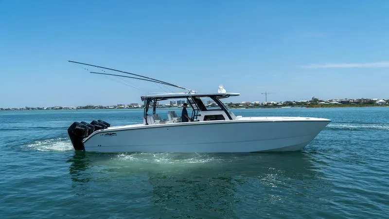  Yacht Photos Pics 2024 Invincible 40' Catamaran cruising on a sunny day.