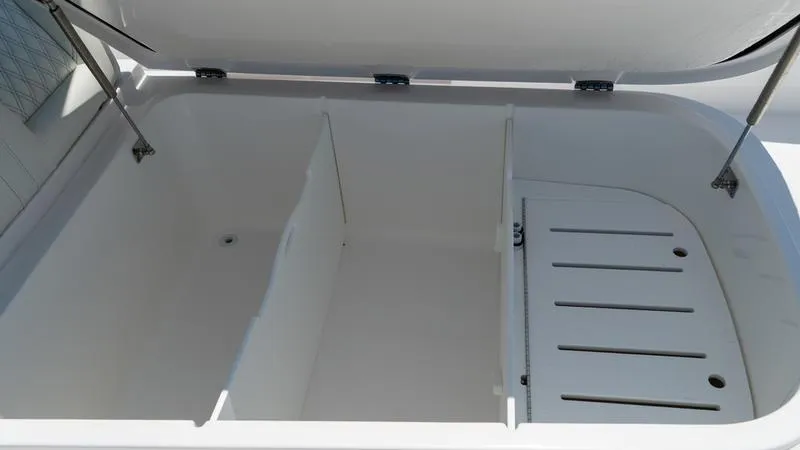  Yacht Photos Pics Open storage compartment of 2024 Invincible 40' Catamaran with dividers and drainage.