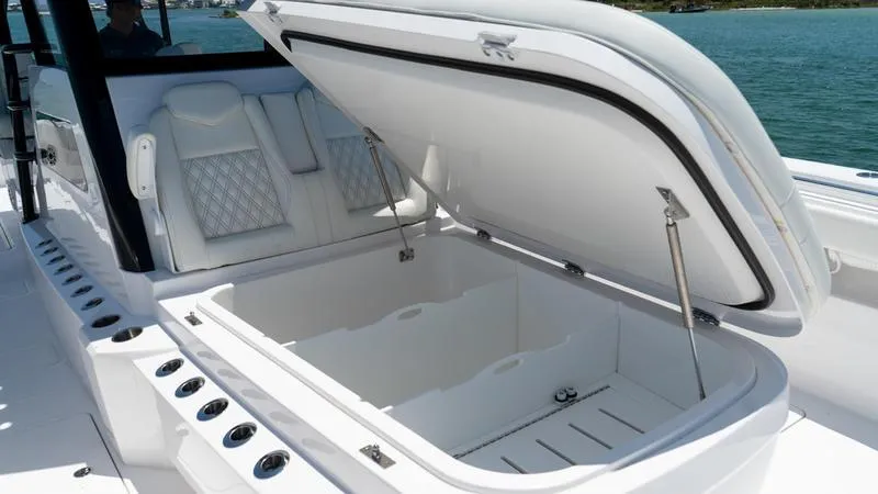  Yacht Photos Pics 2024 Invincible 40' Catamaran with open storage compartment and luxury seating.