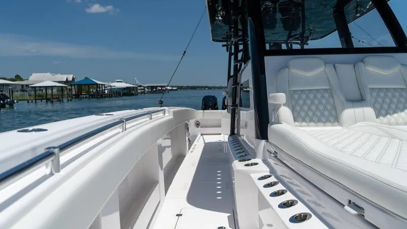  Yacht Photos Pics 2024 Invincible 40' Catamaran, luxury seating, and spacious deck on the water.