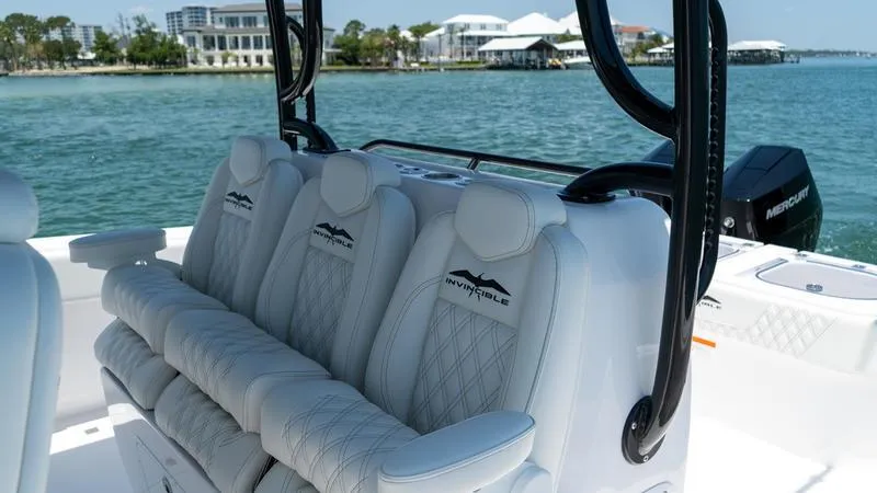  Yacht Photos Pics Luxurious seating on the 2024 Invincible 40' Catamaran, with scenic waterfront backdrop.
