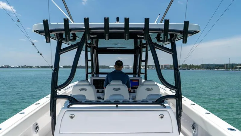  Yacht Photos Pics 2024 Invincible 40' Catamaran on water, rear view of helm station.