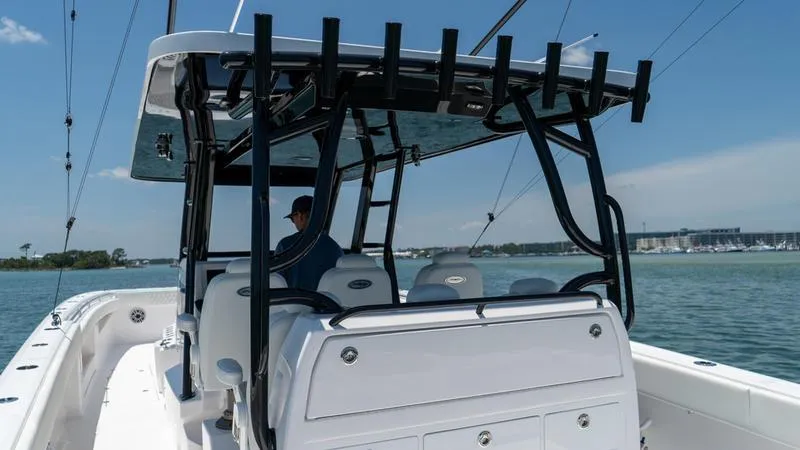  Yacht Photos Pics 2024 Invincible 40' Catamaran on the water, rear view of cockpit and seating.