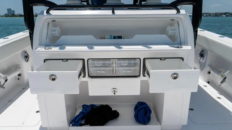  Yacht Photos Pics 2024 Invincible 40' Catamaran with open storage compartments and drawers on deck.