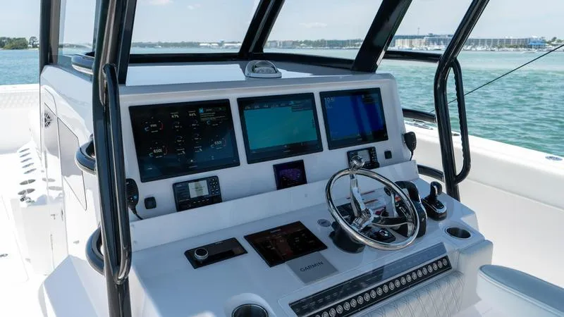  Yacht Photos Pics 2024 Invincible 40' Catamaran helm with advanced navigation systems and controls.